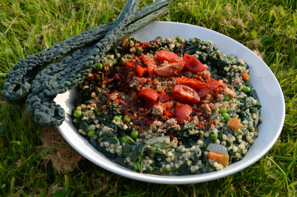 Supergreen buckwheat risotto with kale and spinach and peas